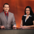 Two reporters sitting together at news desk