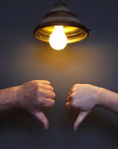 2 thumbs down under lightbulb