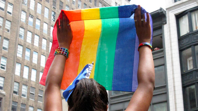 Pride flag being held