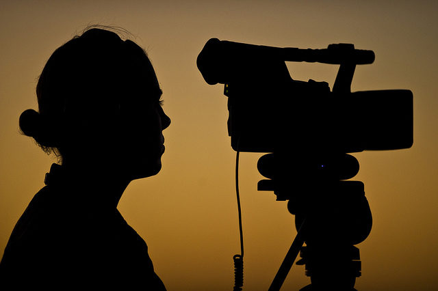 Silhouette of man and camera