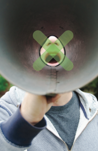 Mouth through megaphone with green x on the mouth