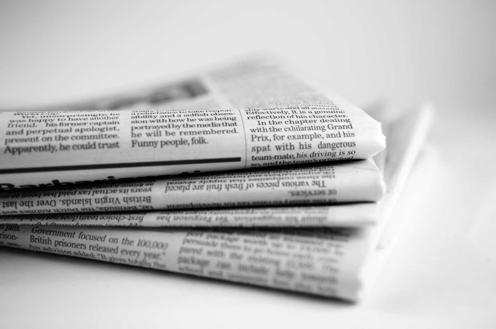 A stock image of a stack of newspapers