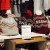 Toques printed with the names of Toronto neighbourhoods sit on a shelf at the Spacing Store in Toronto