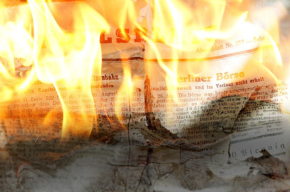 Newspapers on fire