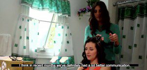 Woman cutting another woman's hair