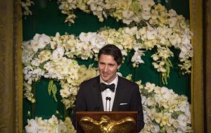 Justin Trudeau speaking at a podium