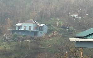 House with major damage due to hurricane