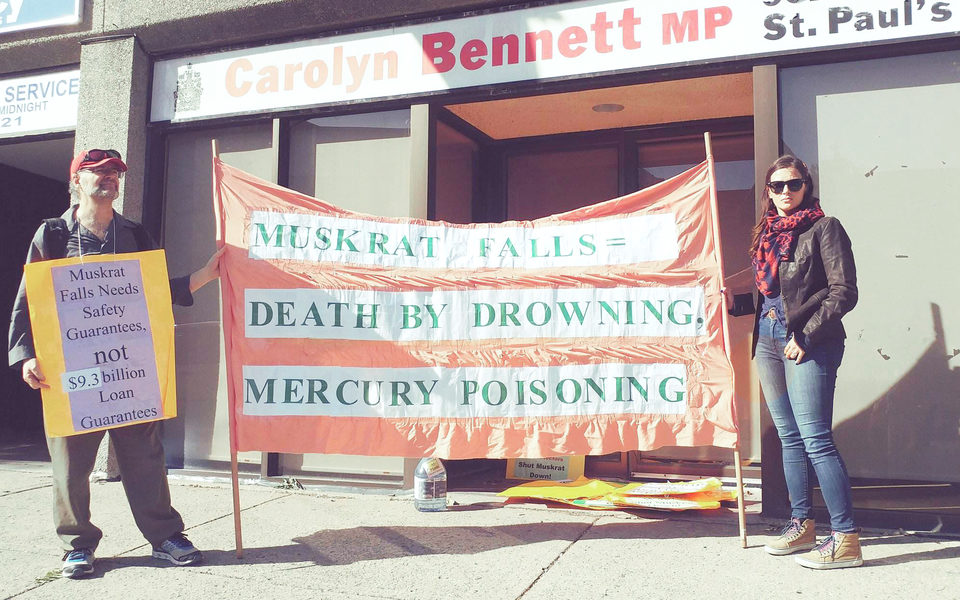 Matthew Behrens and Kelly Morrissey stand outside the old constituency office of Crown-Indigenous Relations and Northern Affairs Minister, Carolyn Bennett on Oct. 2, 2017 in Toronto. (Kenny Sharpe/RRJ)