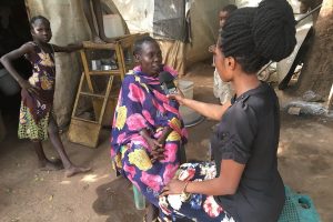 Photo: Laura Bain. JHR journalism trainee interviewing Internally Displaced Persons in Wau, South Sudan