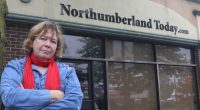 Cecilia Nasmith stands outside Northumberland Today with her arms crossed