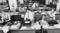 Reporters sit in the NY Times newsroom