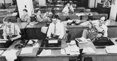 Reporters sit in the NY Times newsroom