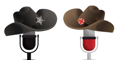 Two microphones wearing cowboy hats face each other. One microphone wears a black hat, the other wears a brown hat with a CBC logo on it.