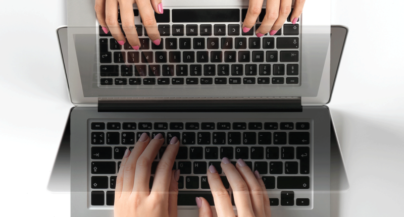 Descriptive image of hand typing on a keyboard